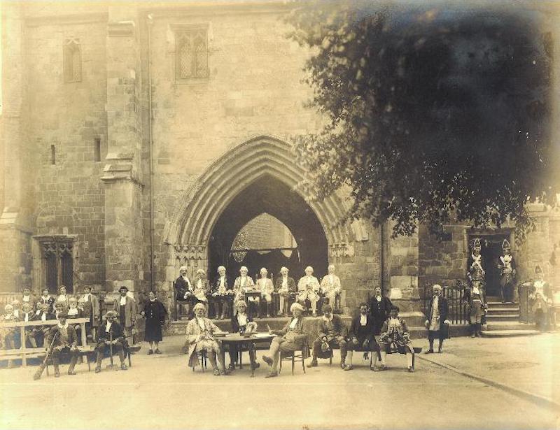 The Court Leet, 1919, the day after the Peace Pageant. It shows gentlemen in wigs and 18th century costume outside the Bayle Gate, Bridlington, arranged as for a court